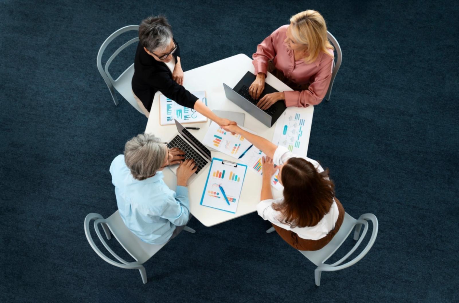 Students working collaboratively on digital administration projects